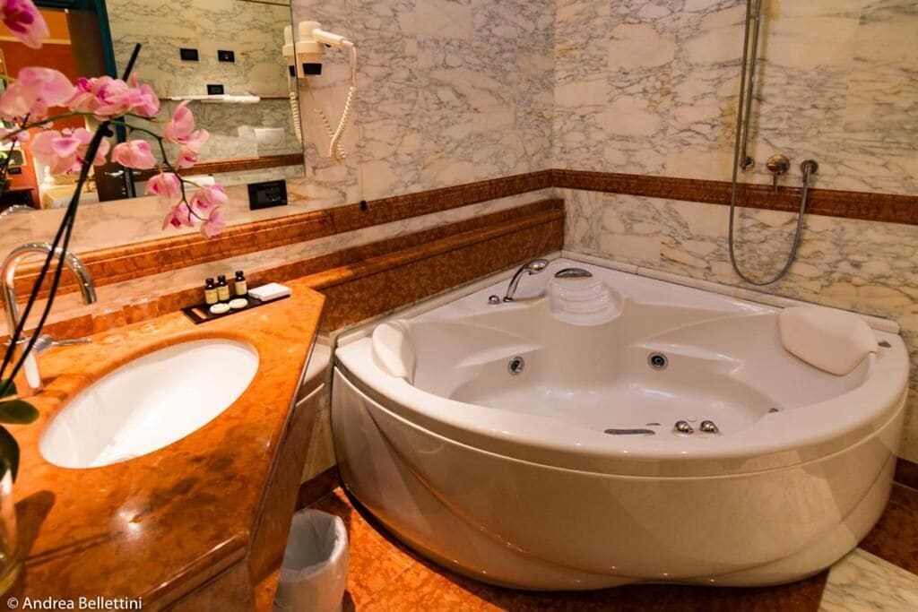 hair dryer, slippers, bidet, towels