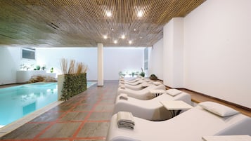 Seasonal outdoor pool, open 9:00 AM to 7:00 PM, pool umbrellas