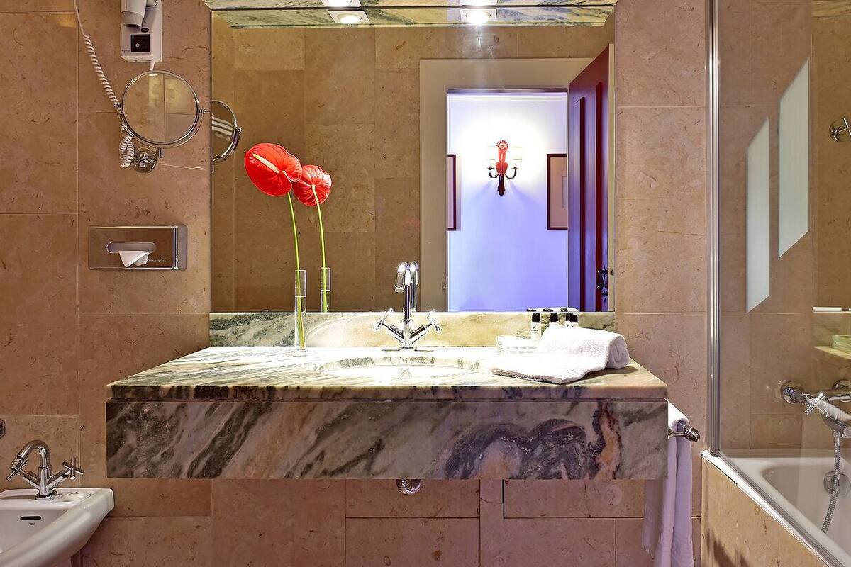 bathtub, eco-friendly toiletries, hair dryer, bidet