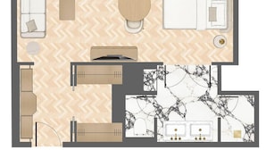 A hotel room layout with a bed, seating area, and kitchenette. - ATHENA Pallas (Athens)