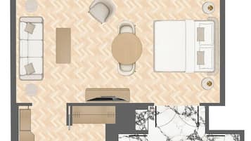 Deluxe Suite | Premium bedding, minibar, in-room safe, blackout drapes