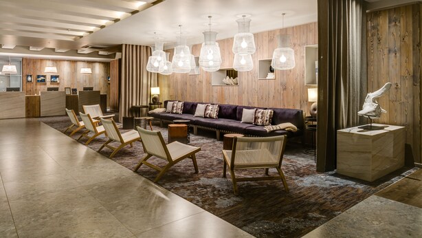 A modern lobby with a reception desk, seating area, and wooden accents. - Protea Hotel by Marriott Durban Umhlanga (Umhlanga)