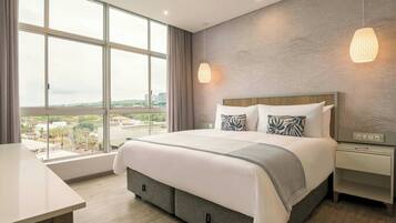 Suite, 1 Bedroom, Partial Ocean View | 1 bedroom, in-room safe, desk, laptop workspace