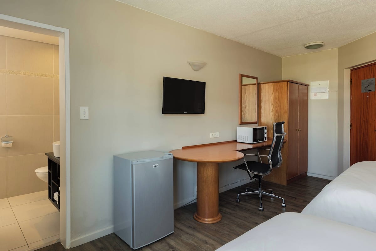 Room, 2 Double Beds, Non Smoking, Garden View | Minibar, in-room safe, desk, iron/ironing board