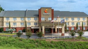 A Comfort Inn & Suites hotel with a central entrance, multiple windows, and a parking lot. - Comfort Inn & Suites Millbrook - Prattville (Millbrook)