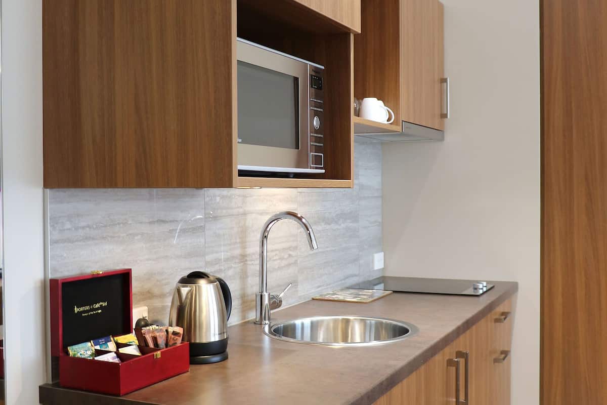 superior studio, kitchen | in-room safe, desk, blackout curtains, iron/ironing board