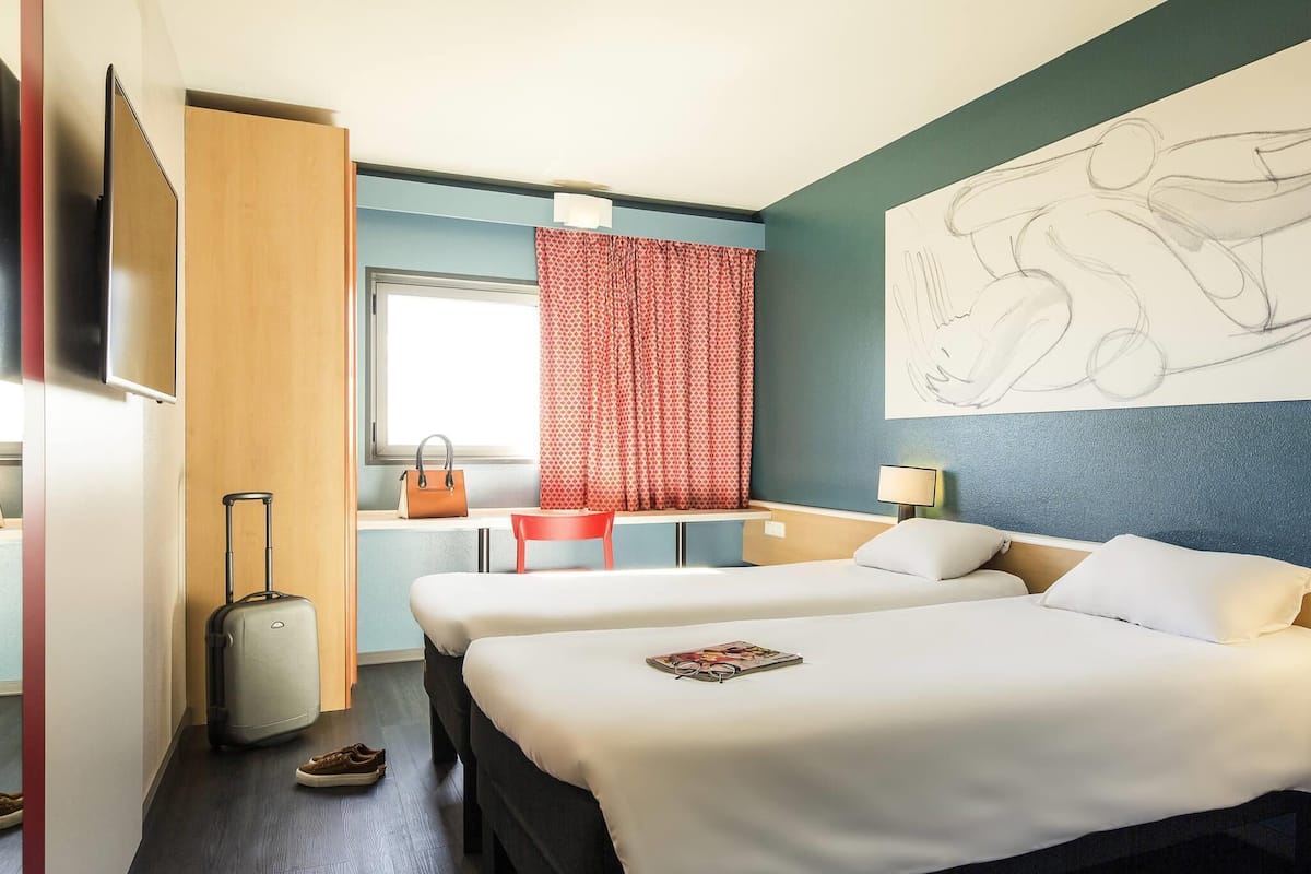 Twin Room, 2 Twin Beds | Down comforters, individually decorated, individually furnished