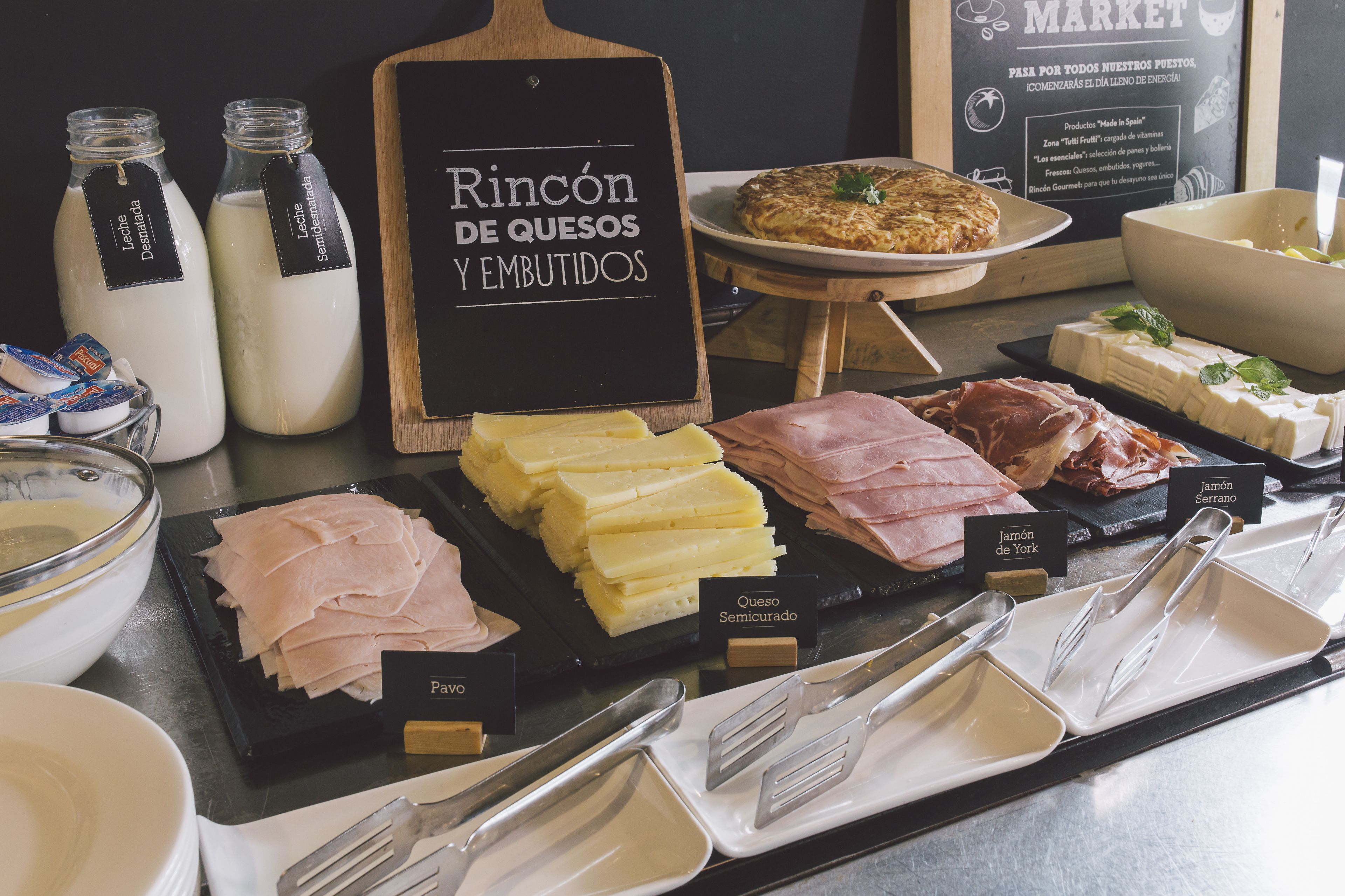 A cheese and ham display with labels for each type.