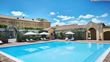 Seasonal outdoor pool, pool umbrellas, pool loungers