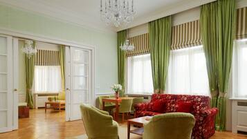 Old Town Square Suite | Living area | 55-cm flat-screen TV with satellite channels, TV