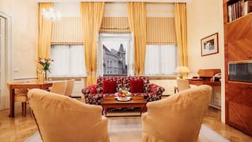 Old Town Square Suite | Living area | 55-cm flat-screen TV with satellite channels, TV