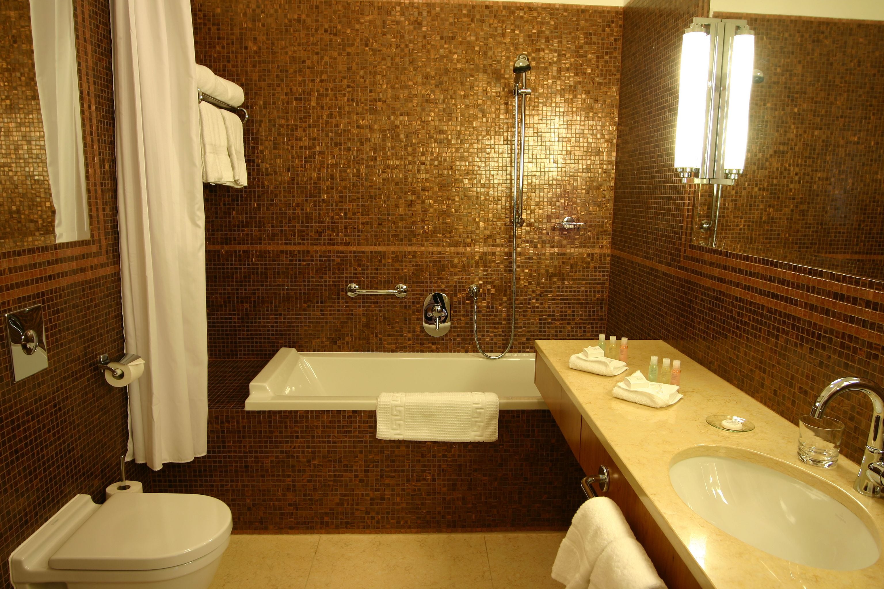 old town square suite | bathroom | bathtub, free toiletries, hair dryer, bathrobes