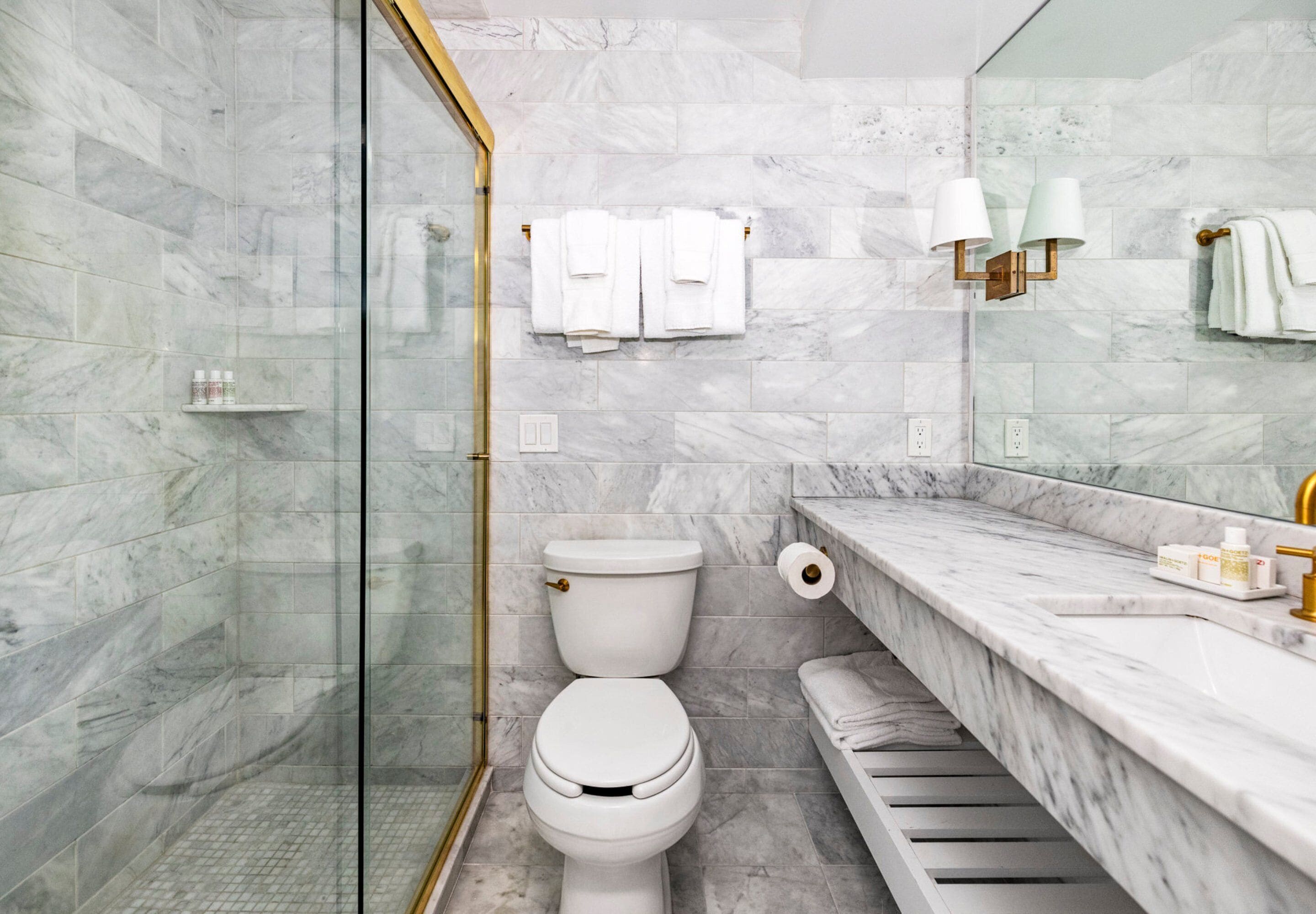 combined shower/bathtub, designer toiletries, hair dryer, bathrobes