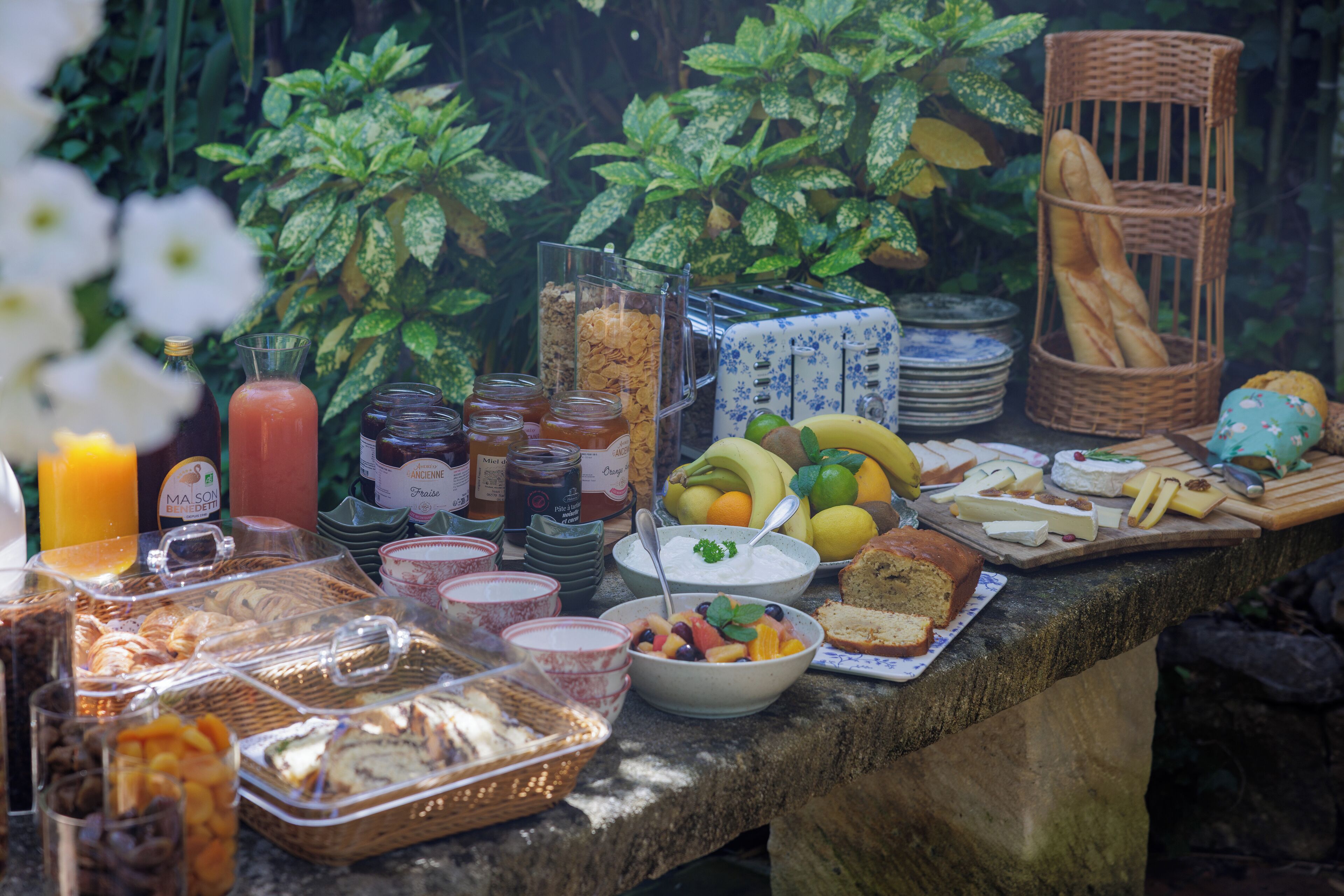 A breakfast buffet with various food items and beverages.