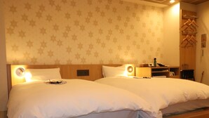 A hotel room with two beds, a nightstand, a chair, and a wardrobe with hangers. - Tokyo Inn (Tokyo)