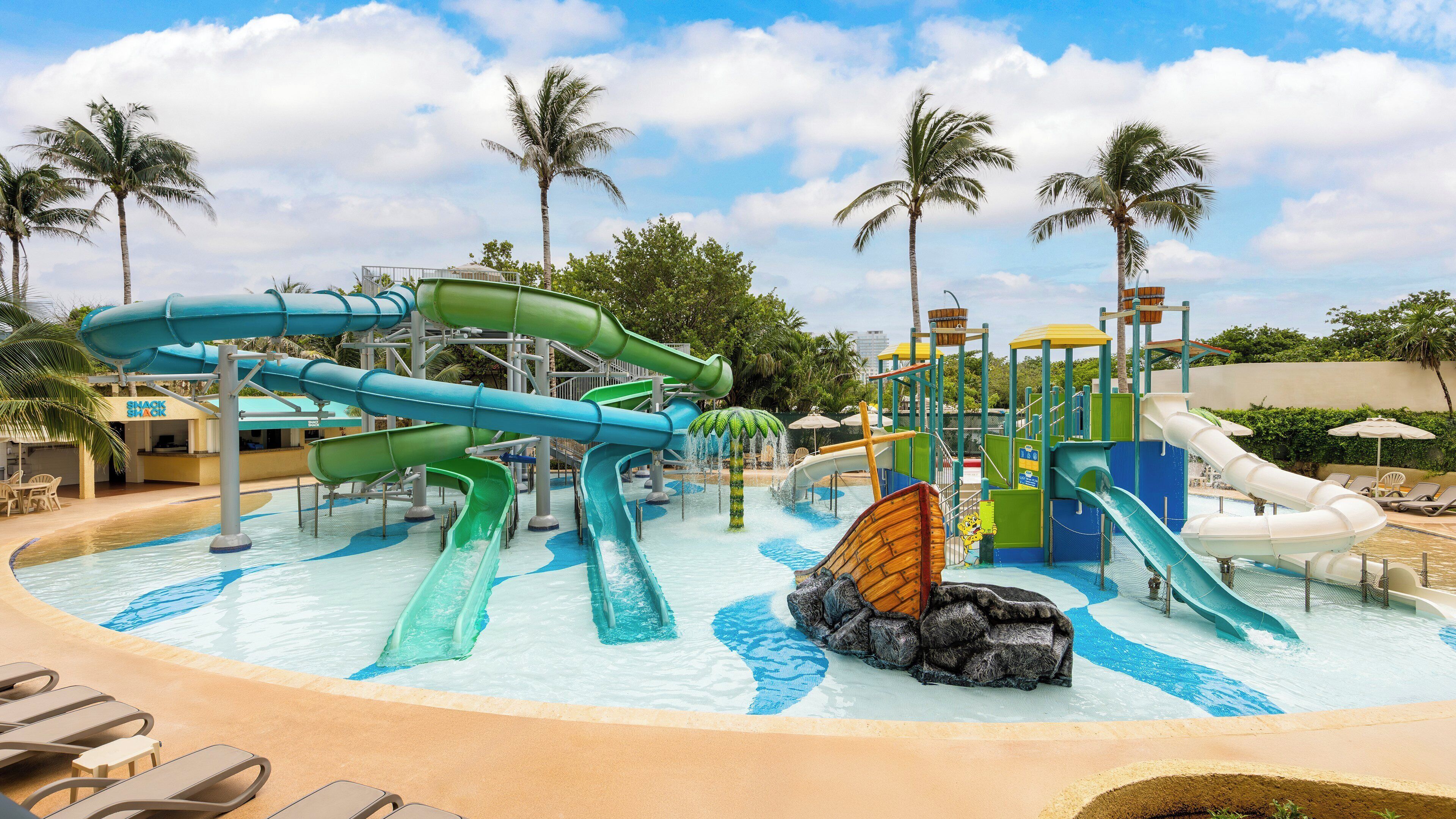 A water park with multiple slides and a pool area.