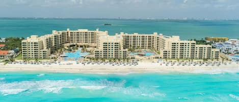 On the beach, white sand, sun-loungers, beach umbrellas