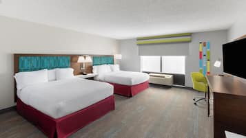 Premium bedding, desk, laptop workspace, blackout drapes