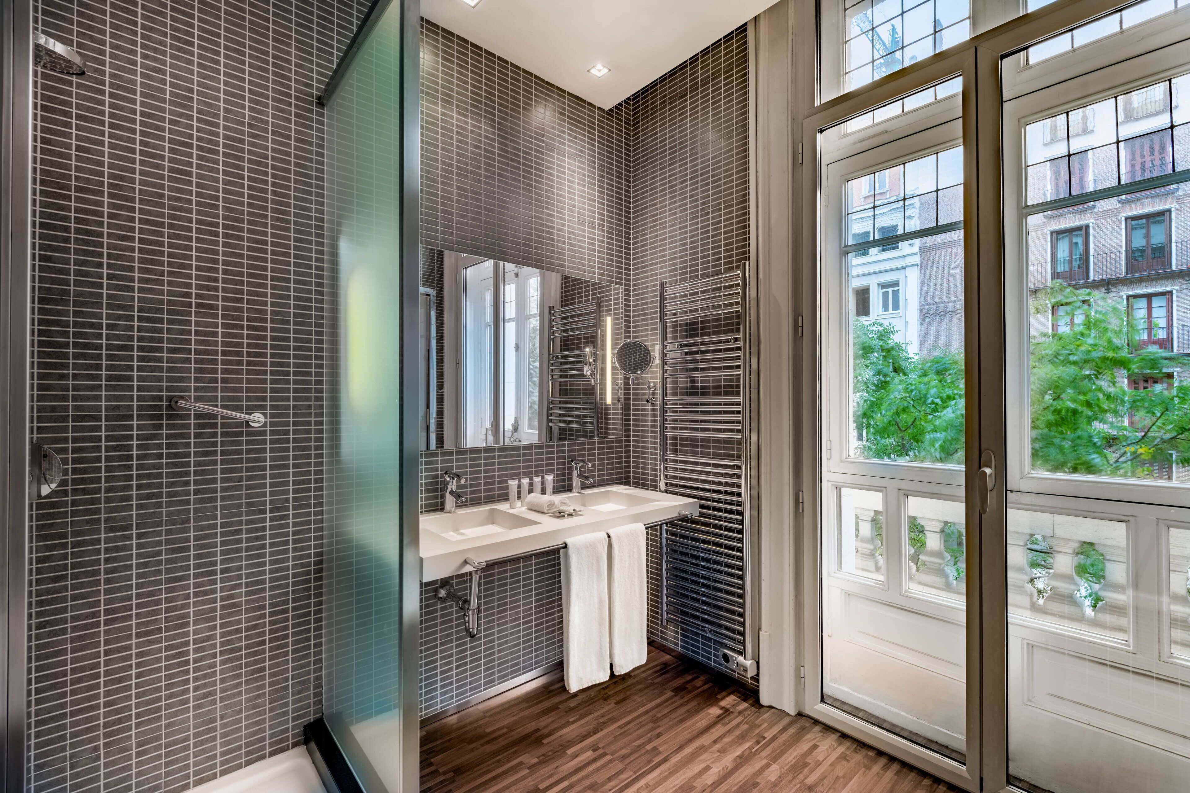 junior suite, 1 king bed, non smoking | bathroom | rainfall showerhead, designer toiletries, hair dryer, bathrobes