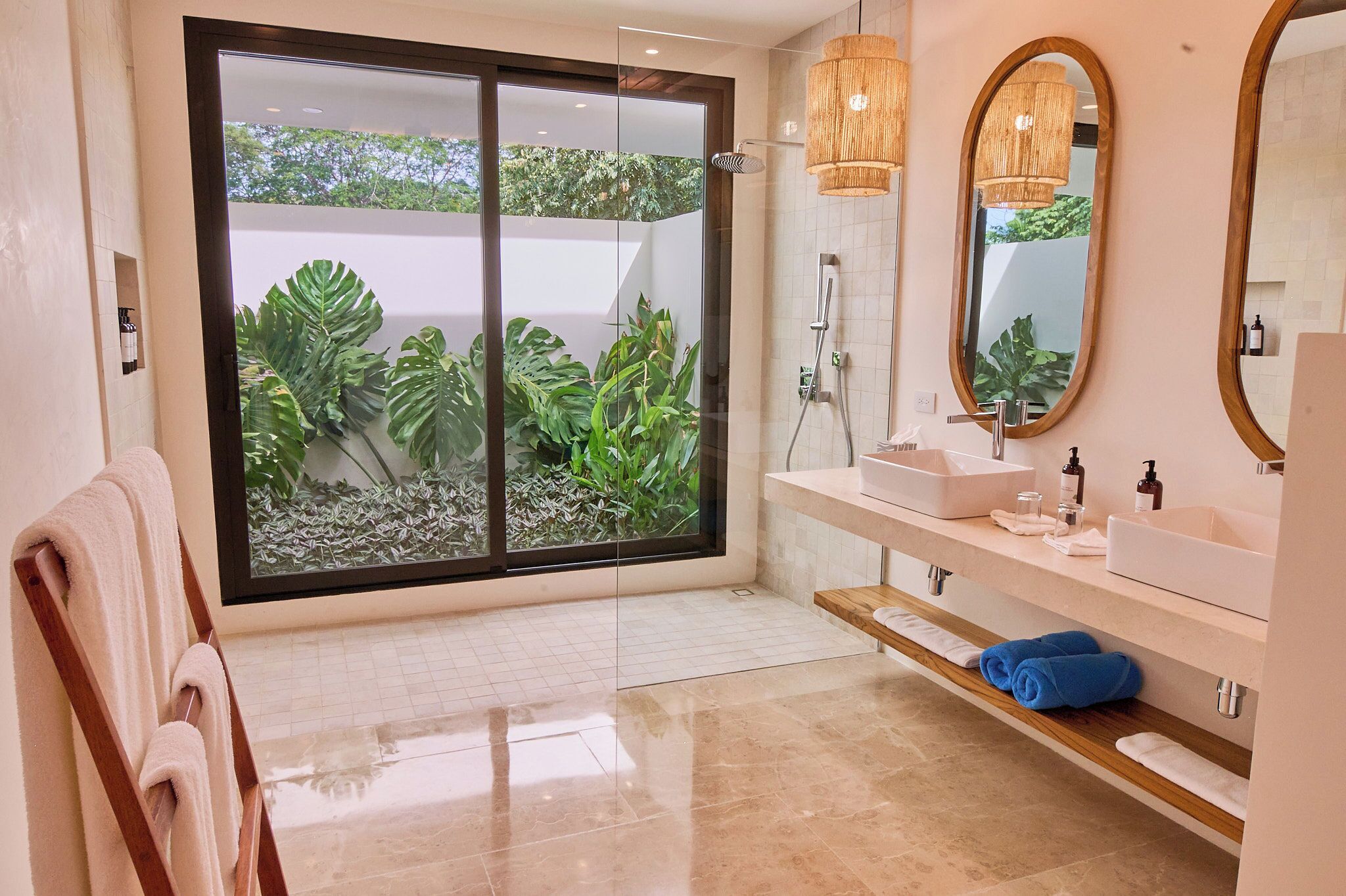 beachfront suite balcony | bathroom | eco-friendly toiletries, hair dryer, towels