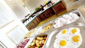 A buffet with various food options including eggs, potatoes, and sausages. - Sumengen Hotel (Istanbul)