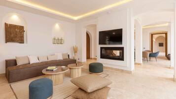 Premium Villa | Living area | 32-cm flat-screen TV with satellite channels, TV, fireplace