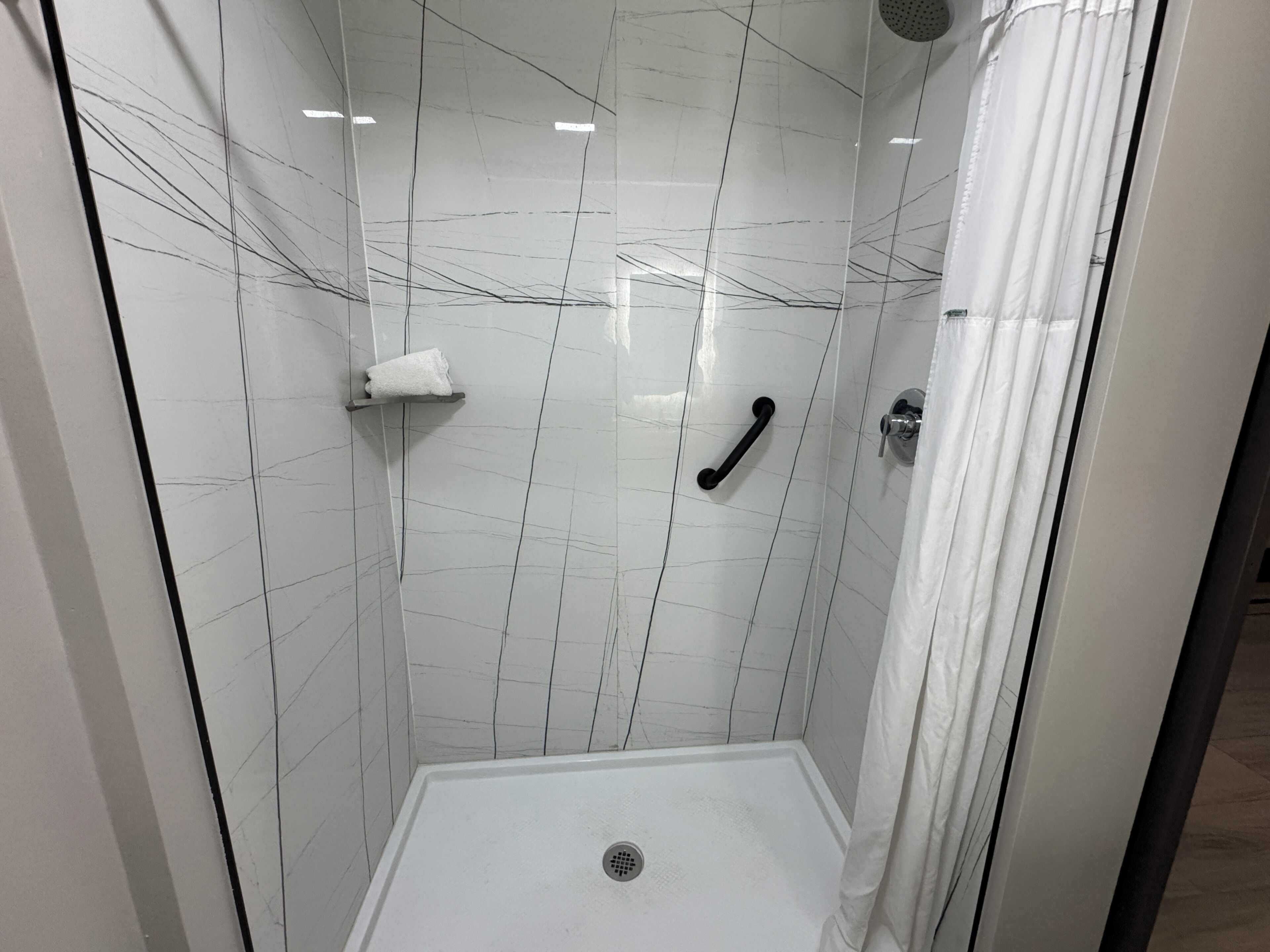 Shower, hydromassage showerhead, designer toiletries, hair dryer