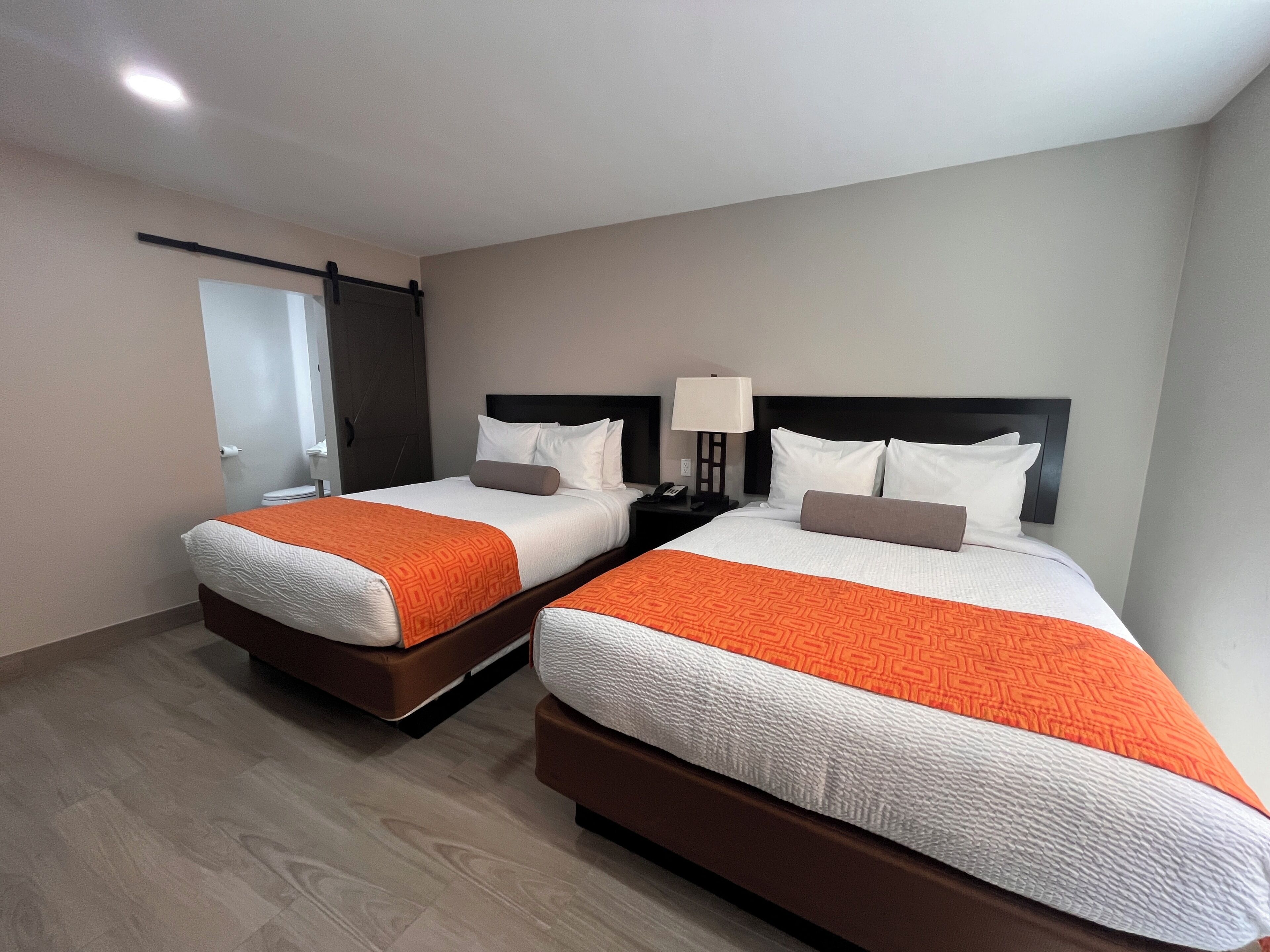 Deluxe Two Queens Non-Smoking | Premium bedding, blackout curtains, free WiFi, bed sheets