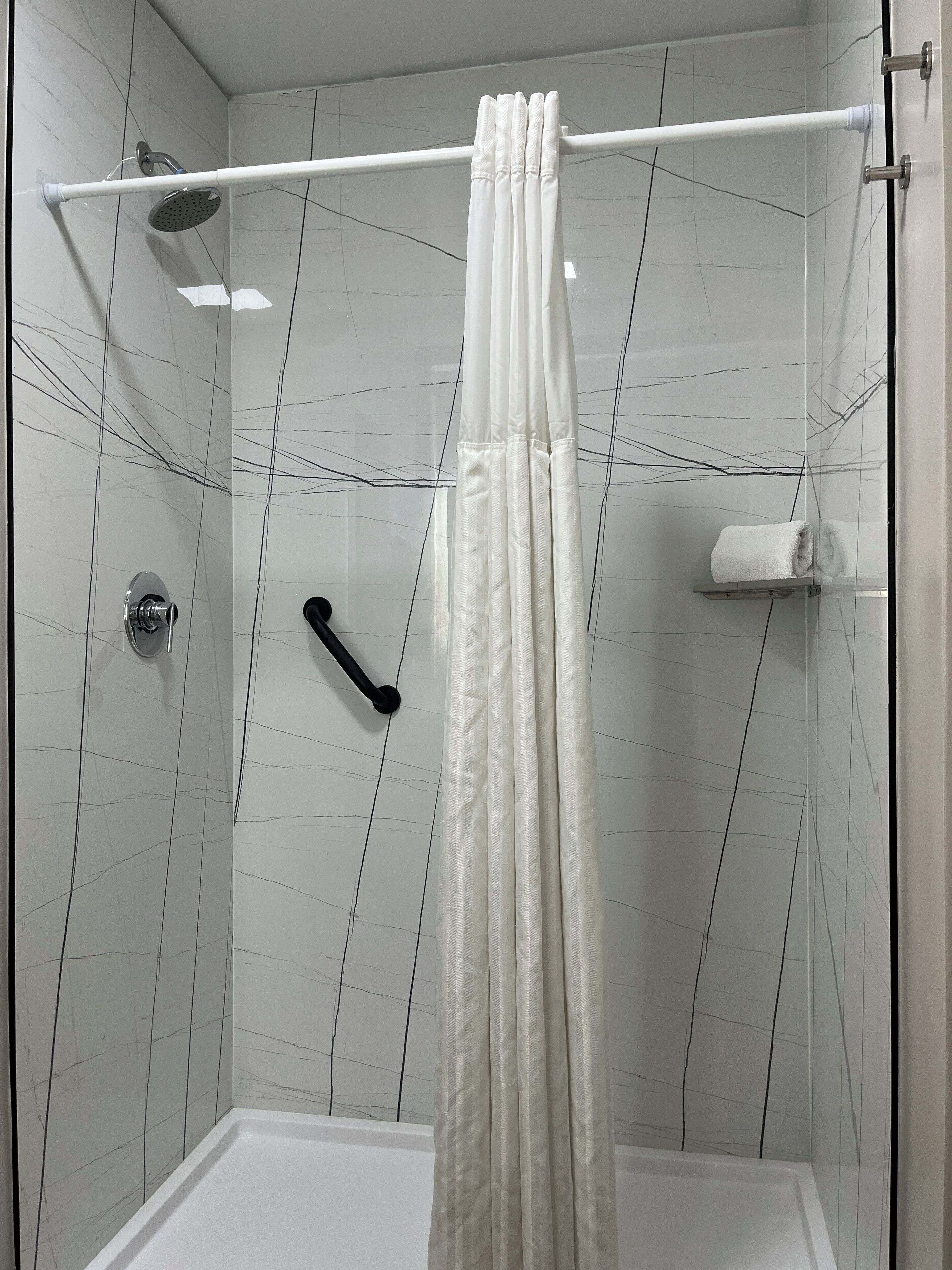 Shower, hydromassage showerhead, designer toiletries, hair dryer
