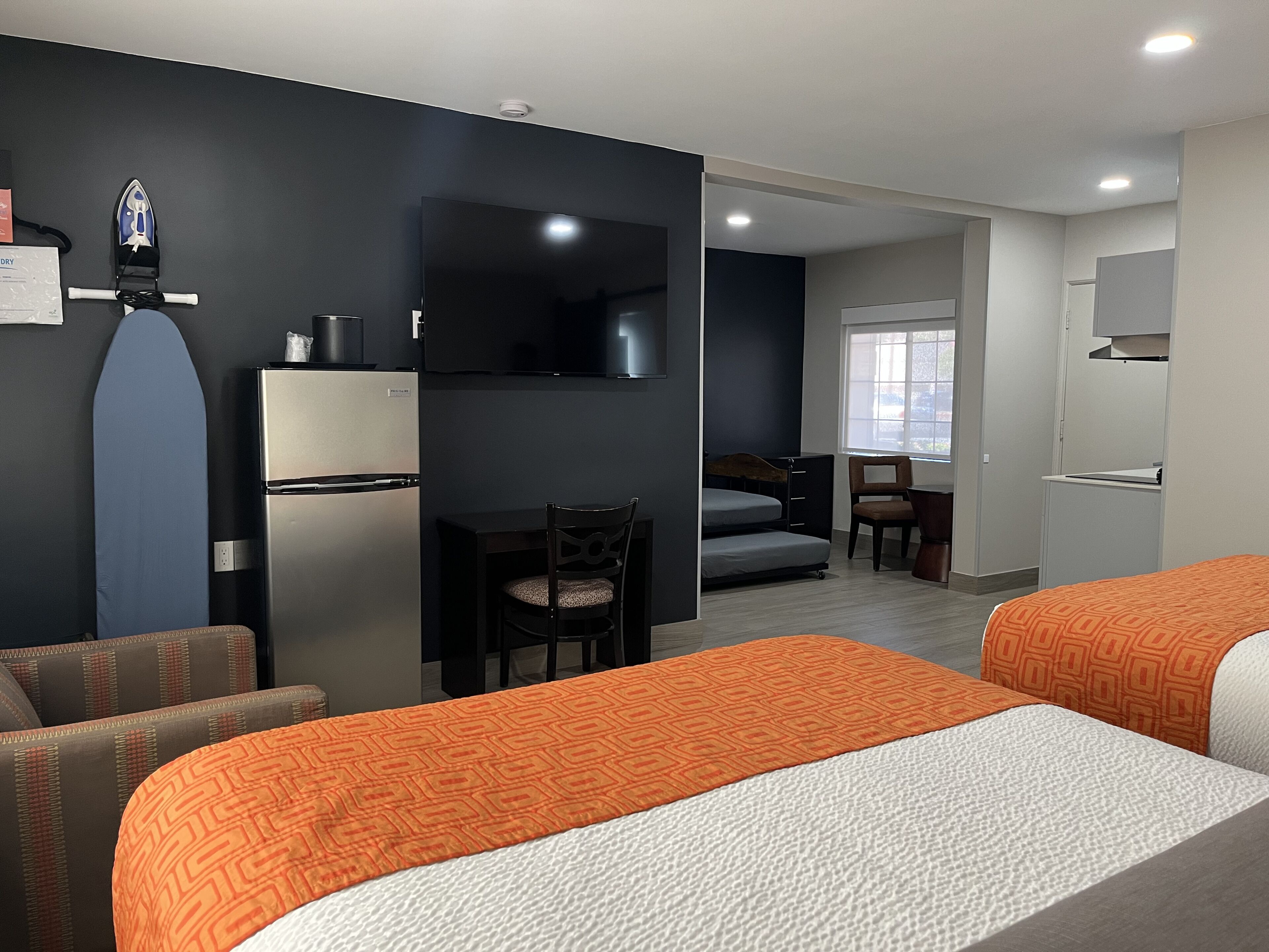 Family Room With Kitchenette | Premium bedding, blackout curtains, free WiFi, bed sheets