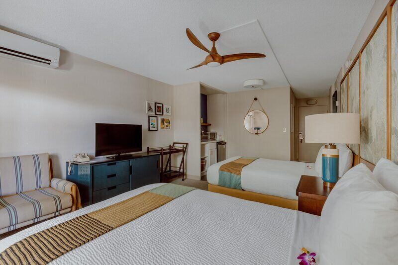 Room, 2 Double Beds, Pool View | In-room safe, desk, laptop workspace, blackout drapes