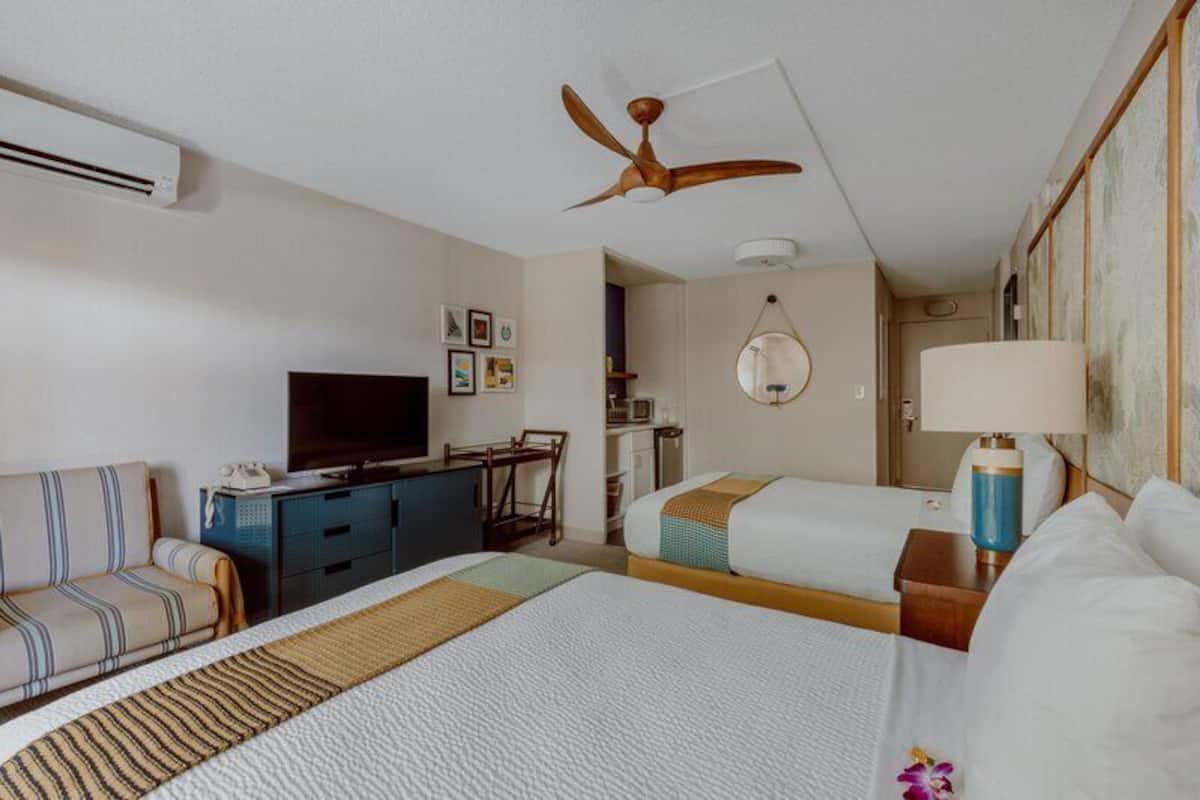 Room, 2 Double Beds, Pool View | In-room safe, desk, laptop workspace, blackout drapes