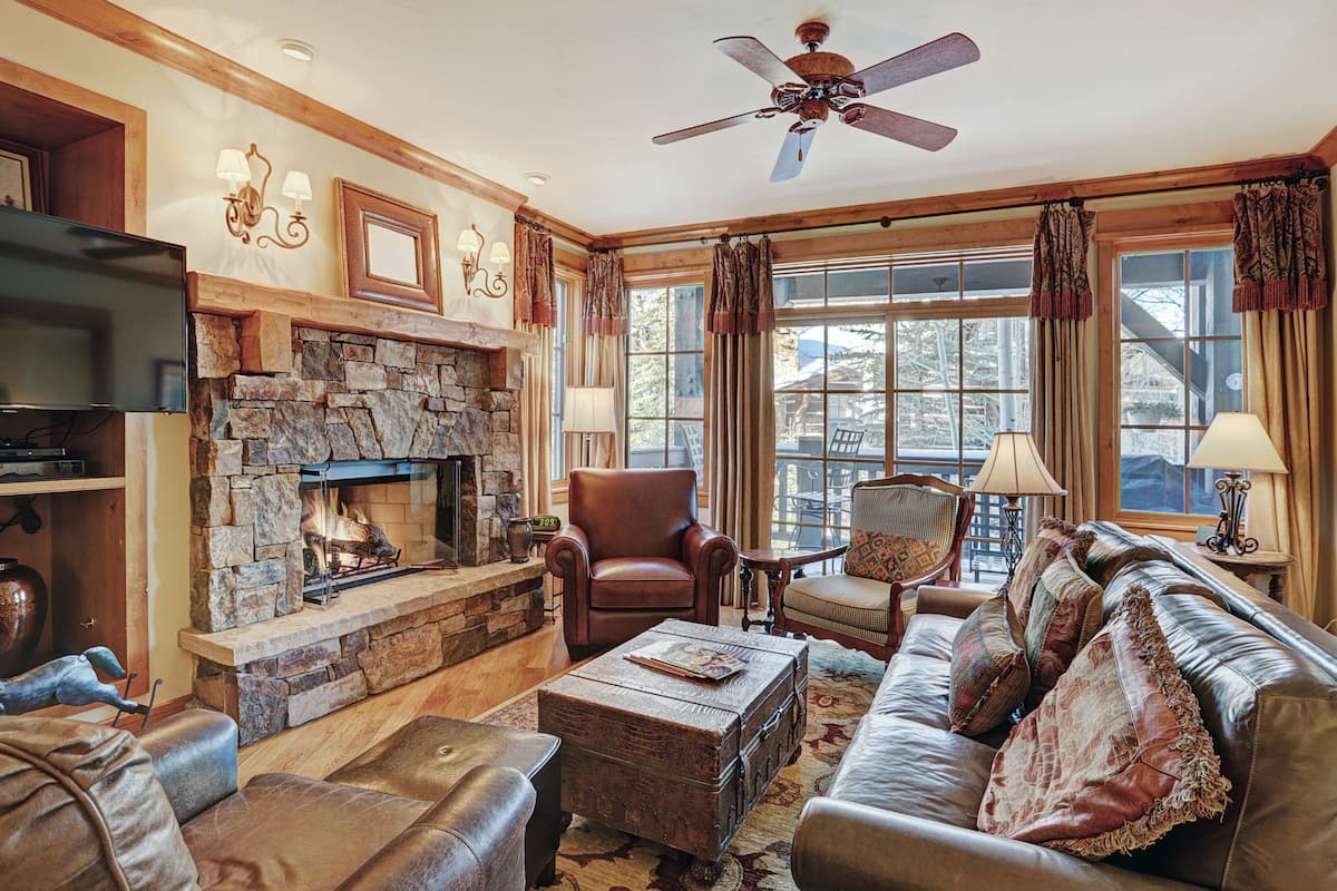 Condo, 2 Bedrooms (Settlers Lodge) | Living area | TV, fireplace, DVD player