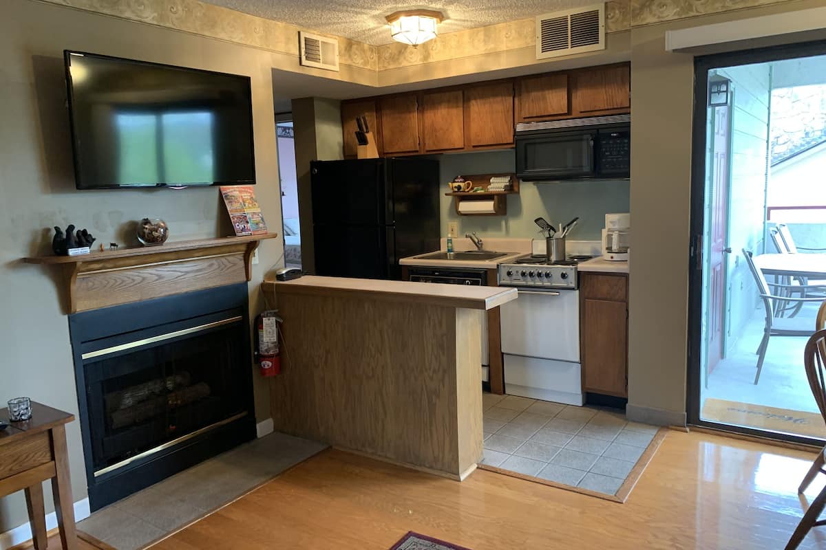 condo, 2 bedrooms (401) | living area | tv, fireplace