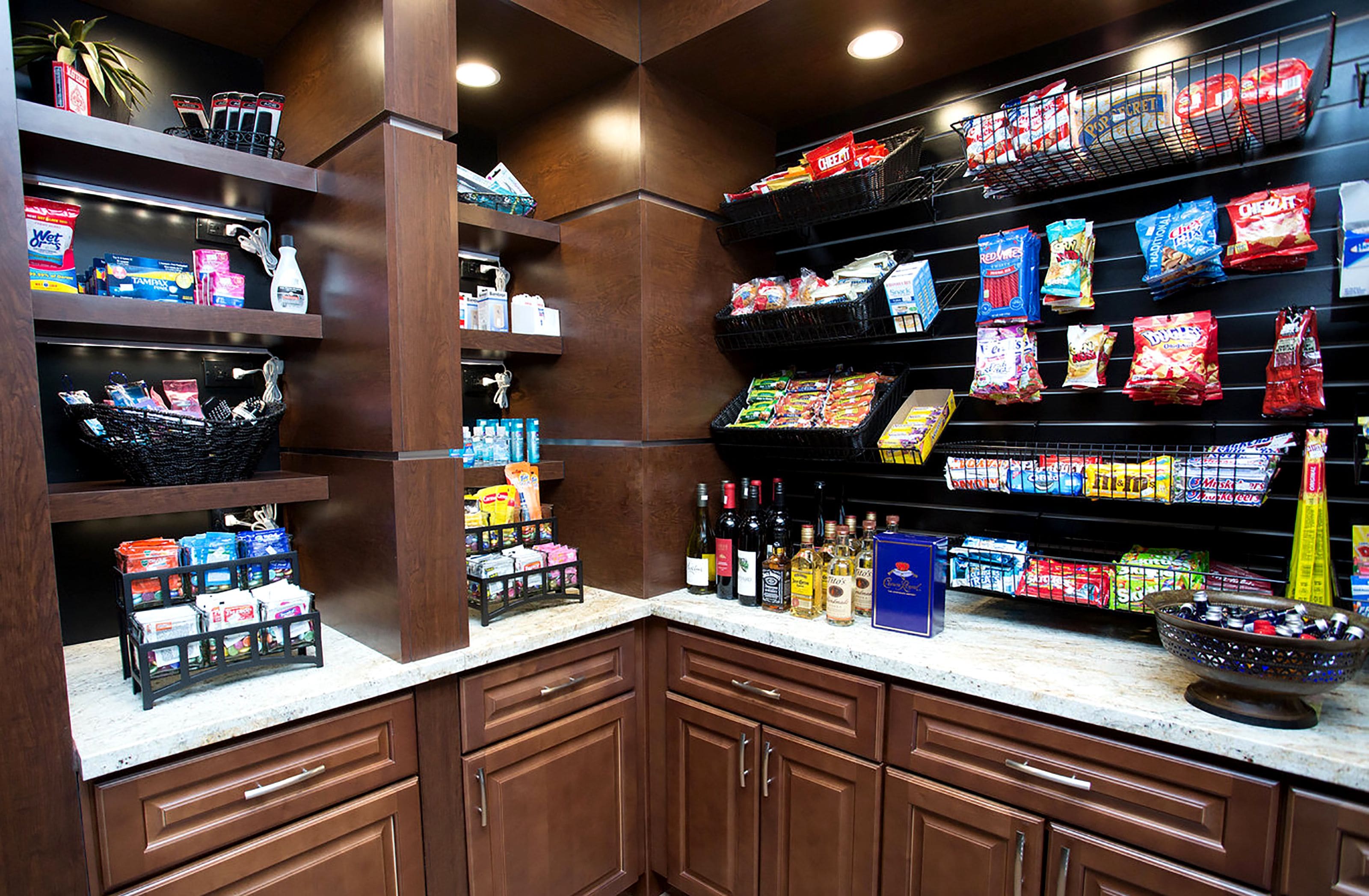 A well-stocked pantry with various food items and beverages.