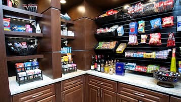 A well-stocked pantry with various food items and beverages.