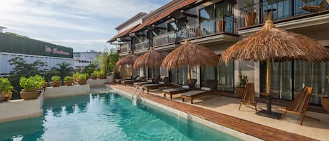 Outdoor pool, open 10:00 AM to 10:00 PM, pool umbrellas, pool loungers