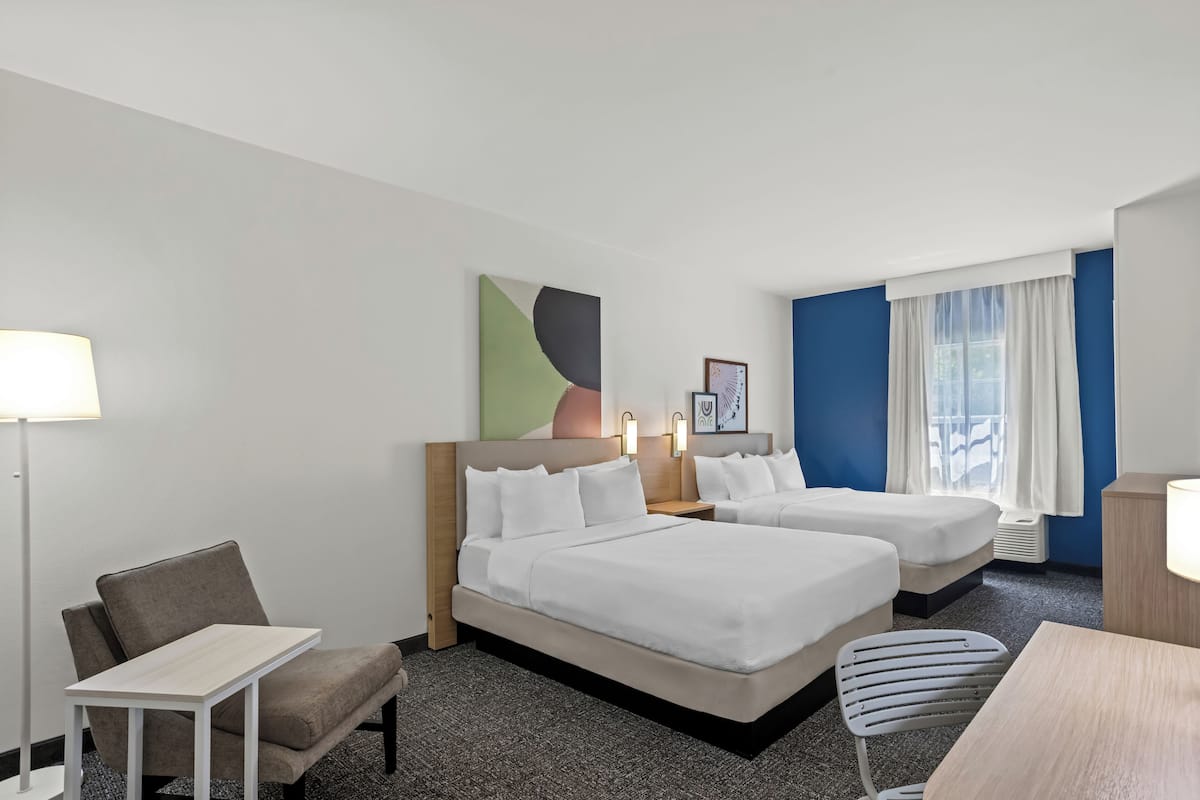 Down comforters, pillowtop beds, desk, laptop workspace