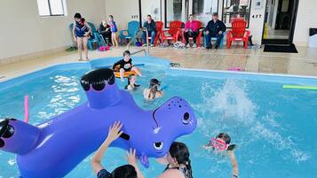 Indoor pool, open 9:00 AM to 11:00 PM, pool loungers