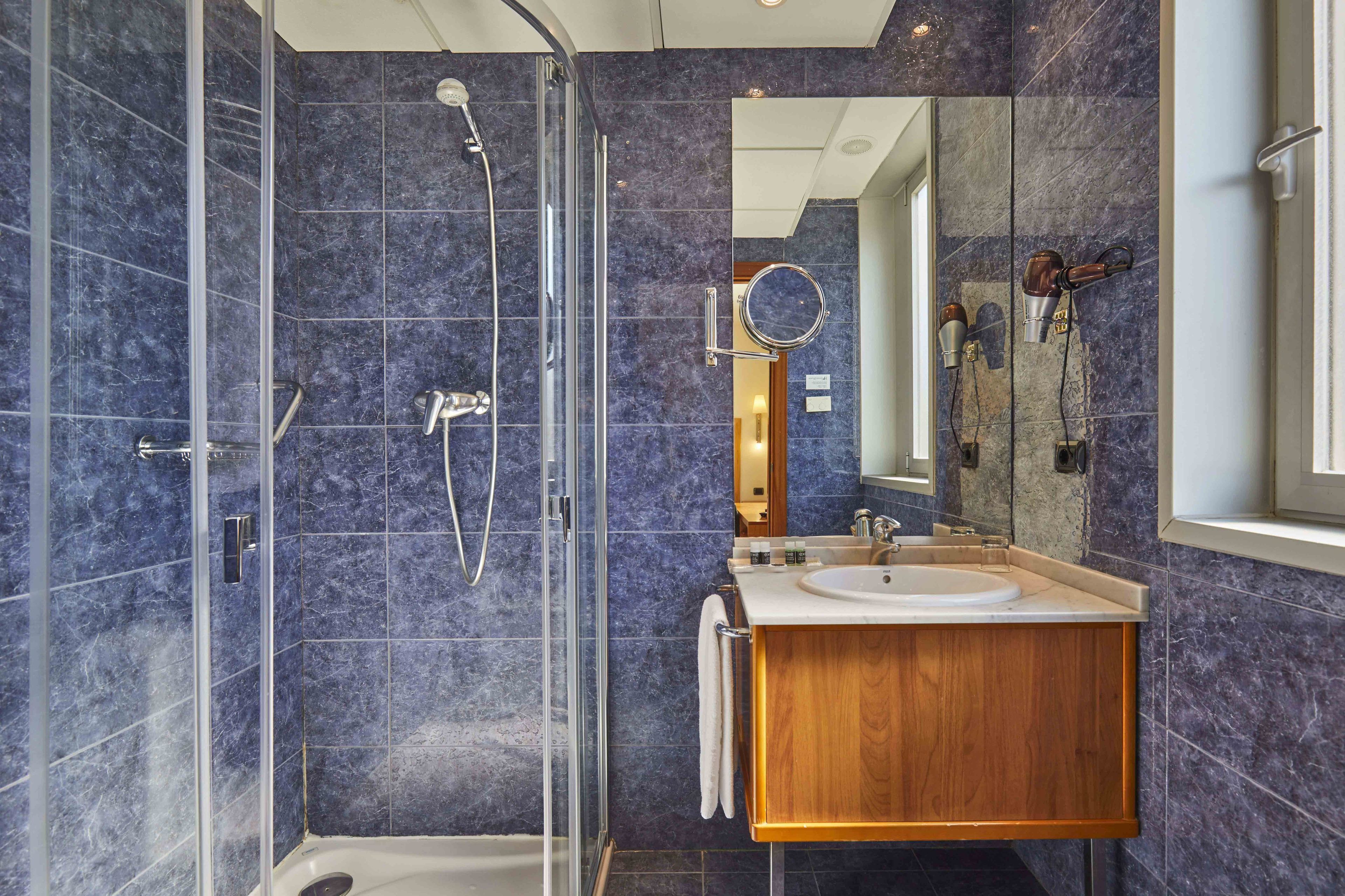 eco-friendly toiletries, hair dryer, towels