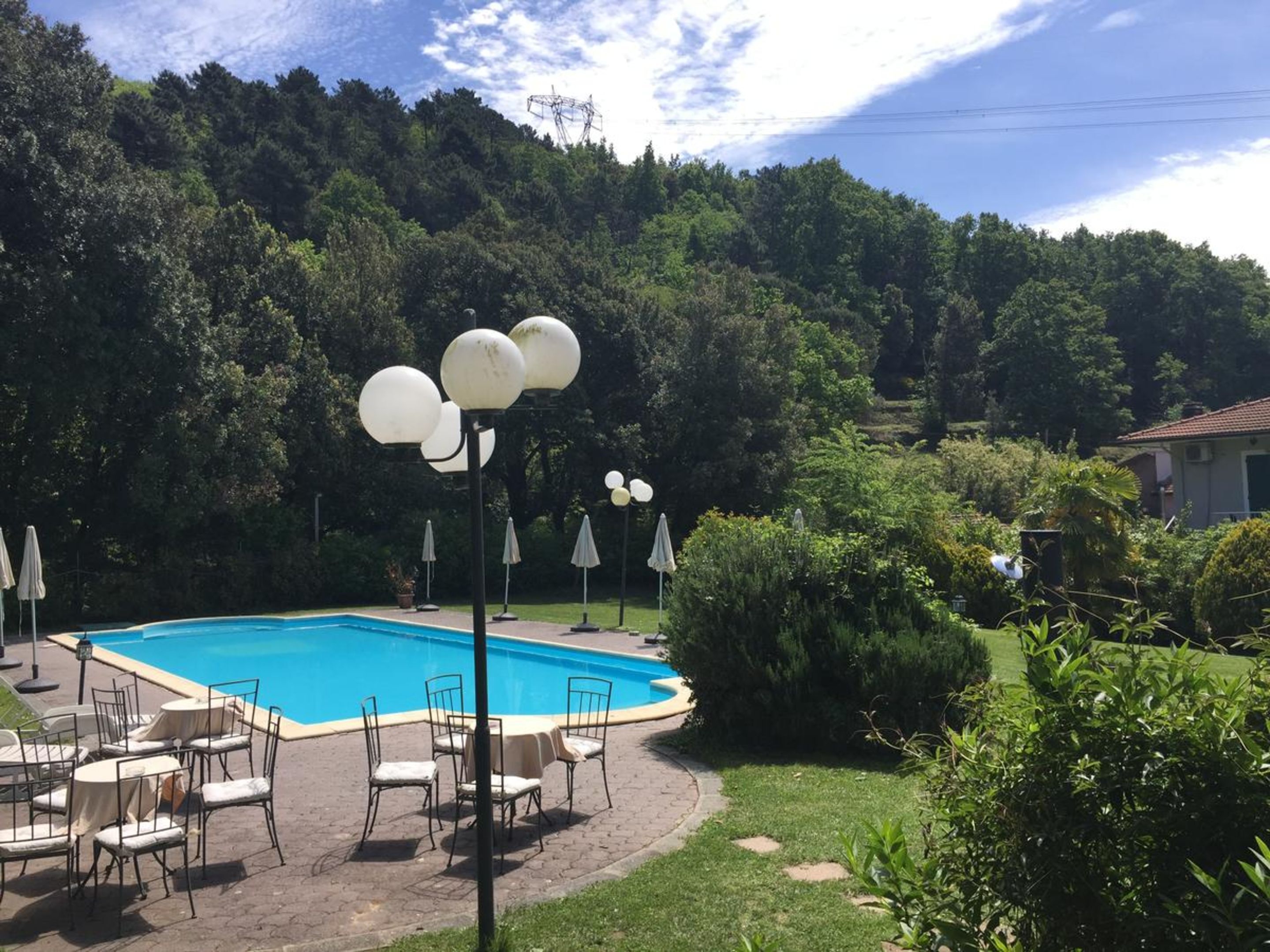 Seasonal outdoor pool, open 9:00 AM to 7:00 PM, pool umbrellas