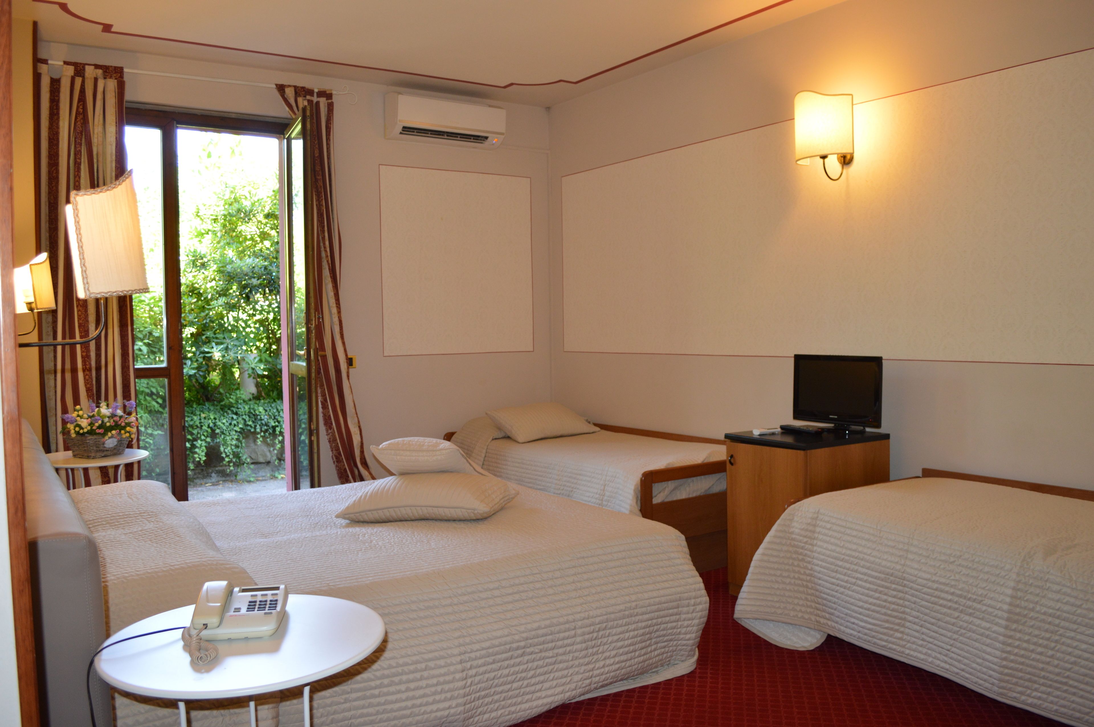 family room | 1 bedroom, minibar, in-room safe, desk