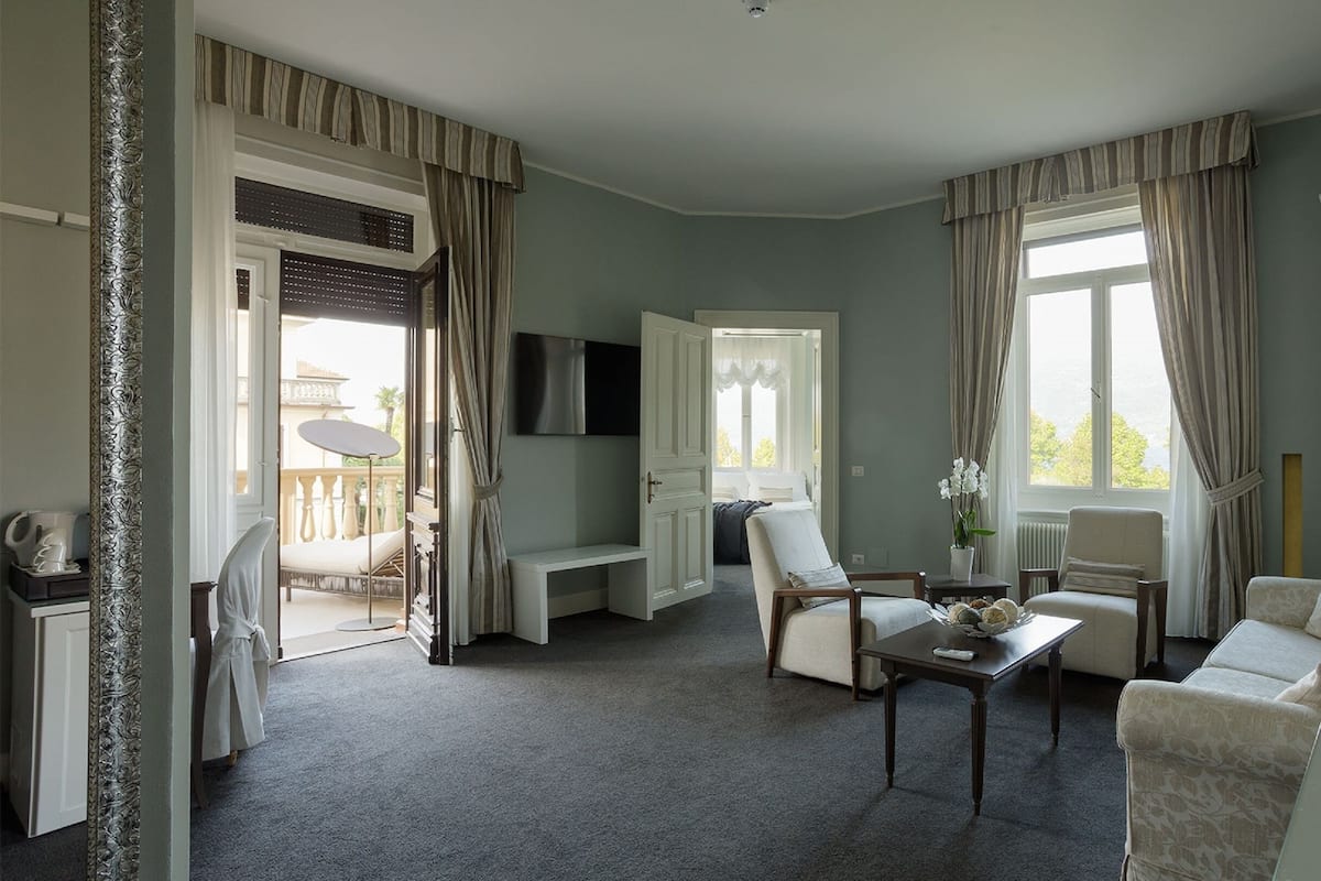 Luxury Suite, Lake View | Living area | TV, pay films