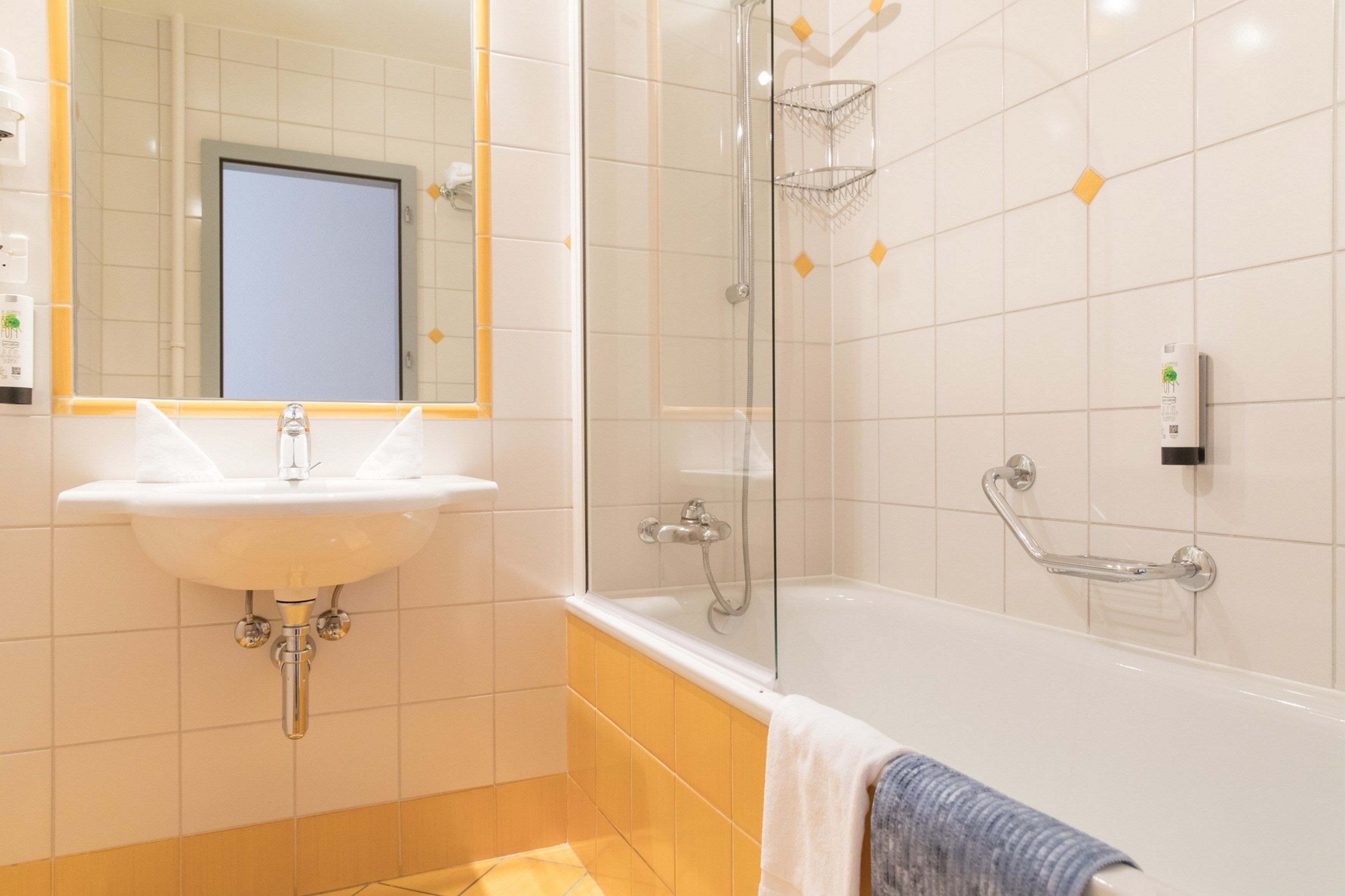 suite | bathroom | shower, hair dryer, towels, soap