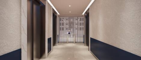 A modern hallway with a marble floor, a blue accent wall, and a decorative panel with a lamp.