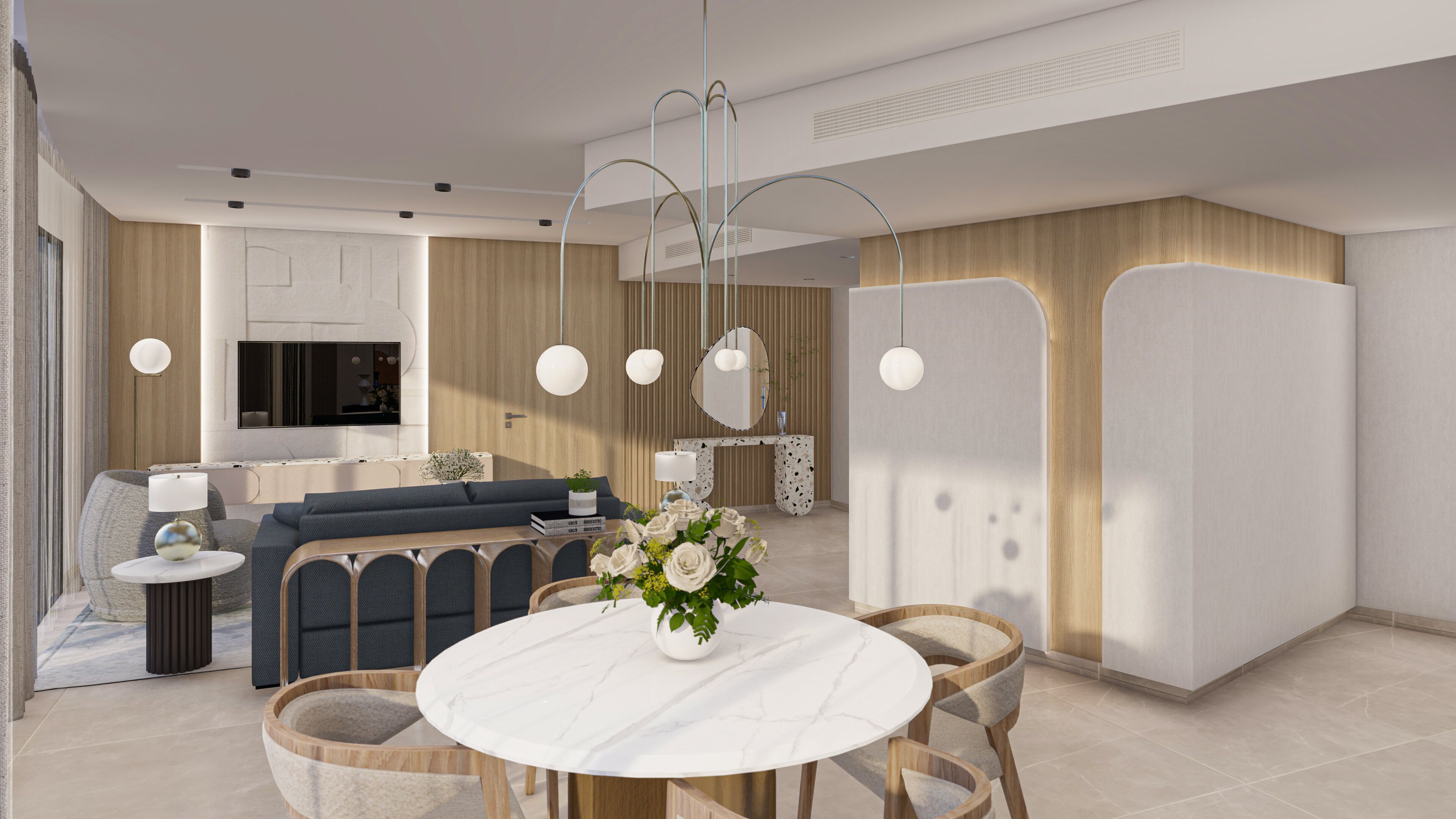 Ein modernes Wohnzimmer mit einer Couch, einem Esstisch mit Stühlen und einer Küchenzeile im Hintergrund.