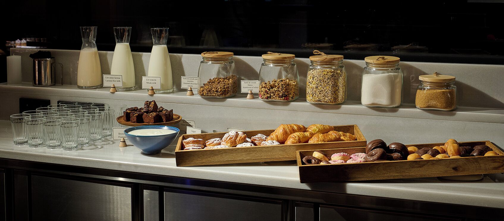 A breakfast buffet with various food items and beverages.