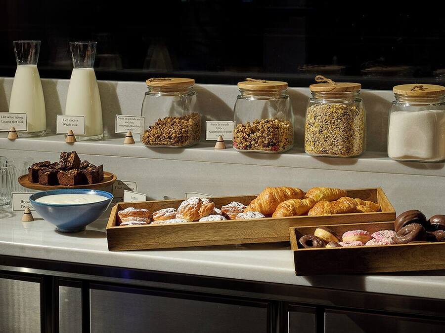 A breakfast buffet with various food items and beverages.