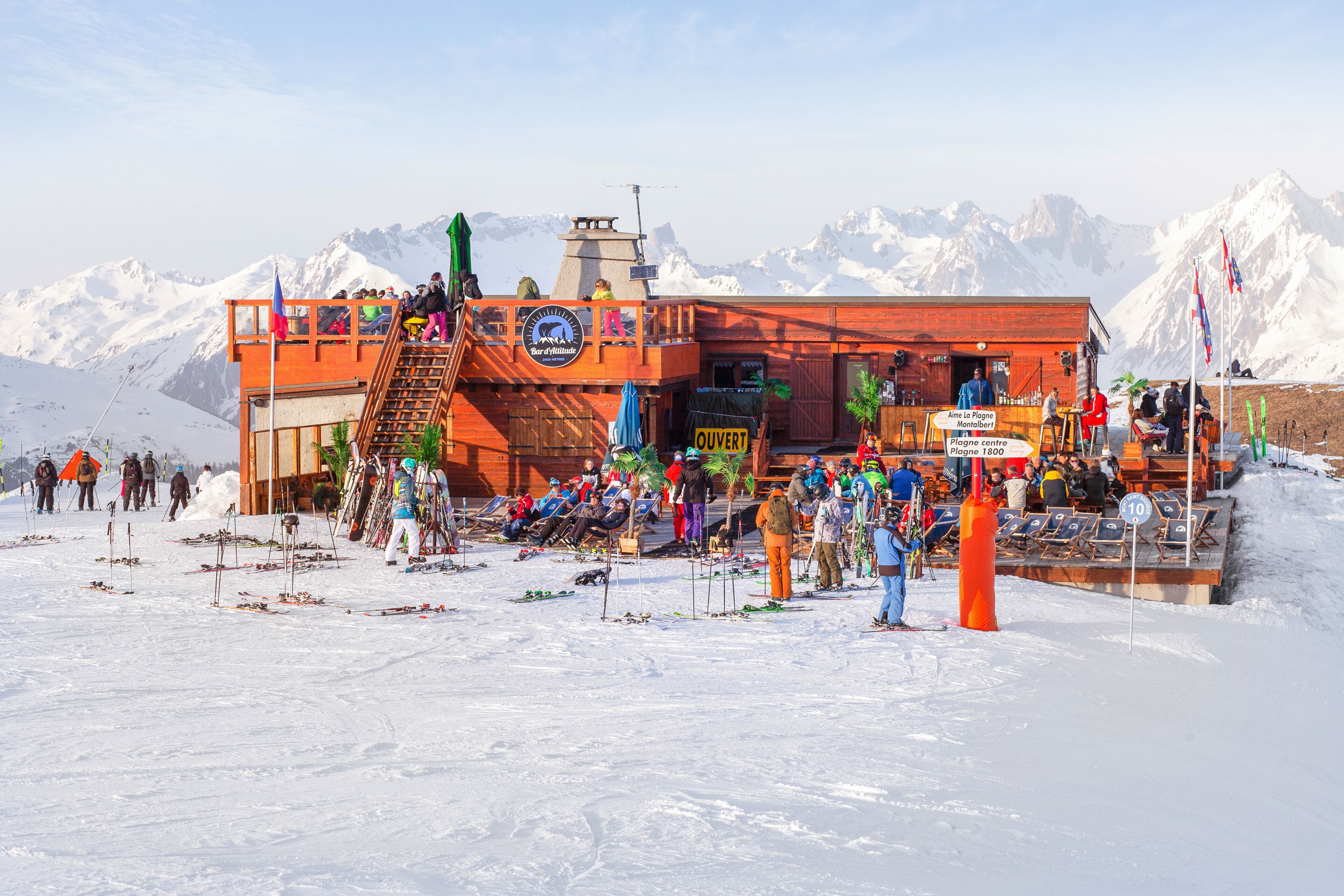 A ski resort with a wooden building and a ski lift.