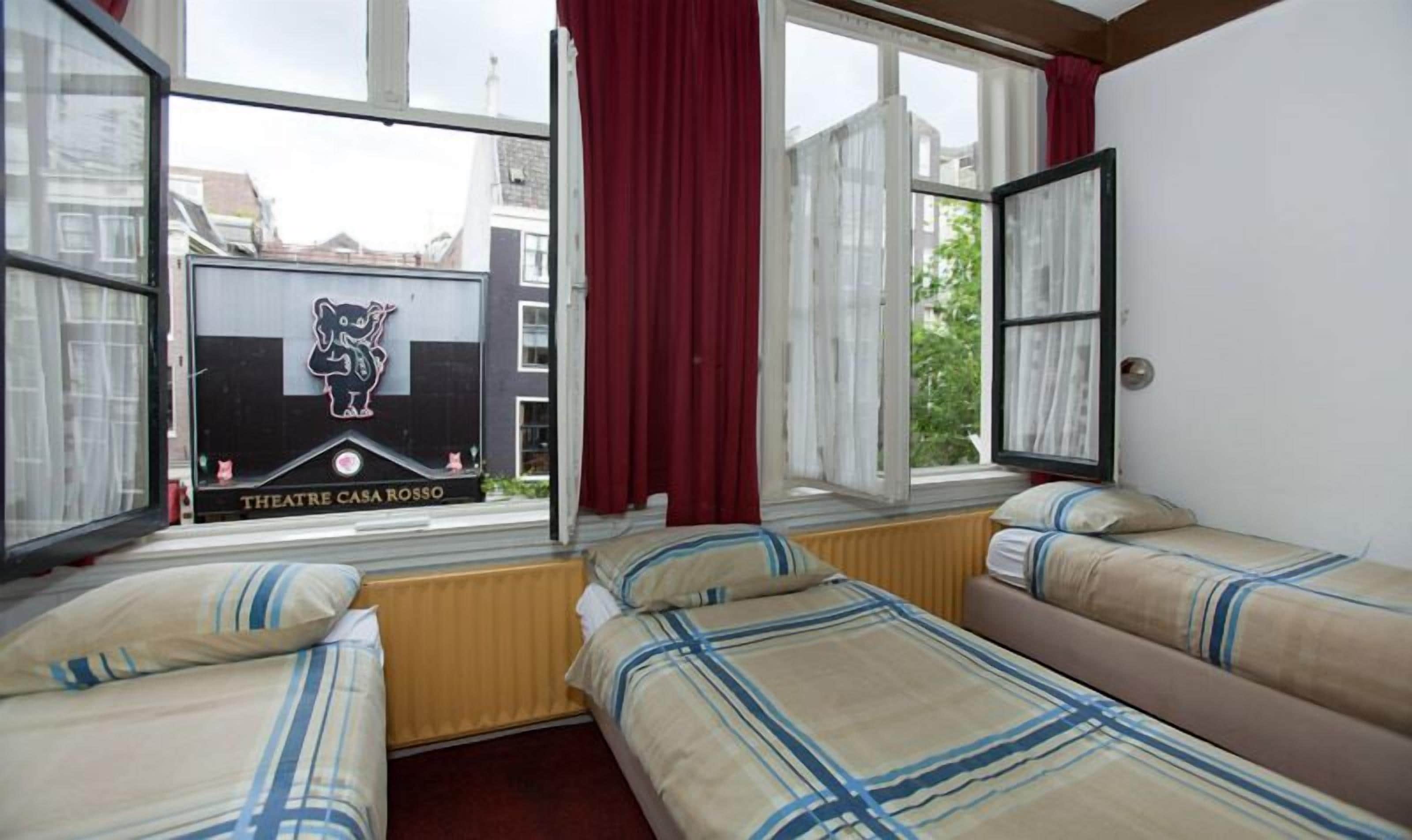 Quadruple Room | Living area | 60-cm flat-screen TV with satellite channels, TV